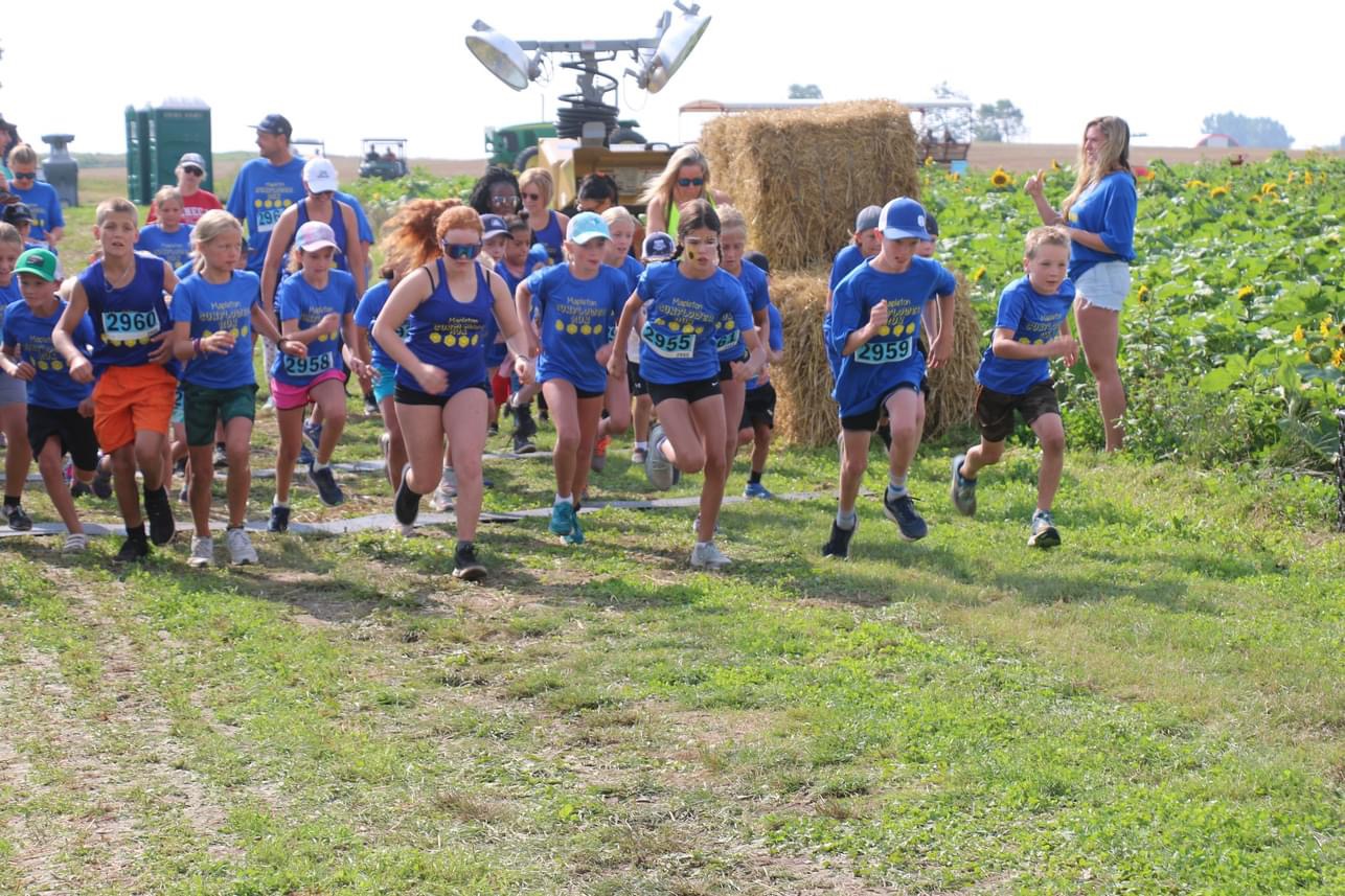 Running through the sunflowers at the fourth annual Shine Your Light Sunflower Tour